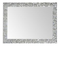 a mirror that is sitting on top of a white surface with diamonds in the middle