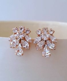 "Rose gold earrings, Bridal earrings, Crystal bridal earrings, Bridesmaids gift, Stud earrings, Cluster earrings,Swarovski crystal earrings Can be made with any Swarovski colors. Please contact me. They are made of gold plated brass and Swarovski crystals. Made with CRYSTALLIZED™ - High-quality genuine Swarovski crystals. ✤ Available in other metal finishes at the drop-down menu. ✤ Stud/post Earrings. Clip-on earrings are available upon request. ✤ Size approx - 31 mm x 19 mm at the widest points Gold Earrings Bridal, Bridal Earrings Studs, White Opal Earrings, Crystal Bridal Earrings, Gold Bridal Earrings, Bridal Earrings Pearl, Earrings Crystal, Swarovski Crystal Earrings, Emerald Earrings