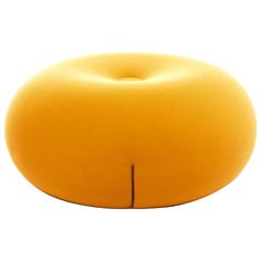 an orange object sitting on top of a white surface