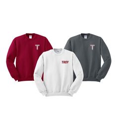 Troy University Crewneck Sweatshirt -UH Spirit Wear Troy University Crewneck Sweatshirt Embroidered with choice of Troy or Troy Power T.  Traditional crewneck made of the NuBlend pill resistant fleece. Keep cozy and warm this winter or all year round. Unisex Sizing S-4XL.  White, Black, Charcoal, Athletic Grey, Cardinal, Dark Heather Additional Colors Available Upon Request. 50/50 Cotton/Polyester  NuBlend® Pre-shrunk Fleece 8.0 oz / 271 g NuBlend® pill-resistant fleece Made with sustainably sourced USA grown cotton High stitch density for a smooth printing canvas Tear-away label 1x1 rib collar with spandex Two-needle coverstitching on collar, armholes and waistband 1x1 rib cuffs and waistband with spandex for stretch and recovery Quarter-turned to eliminate center crease Imported NO Retur Embroidered Spirit Wear, Crew Neck Top With Embroidered Text For College, Red Embroidered Crew Tops, Red Long Sleeve Top With Letter Embroidery, Troy Trojans, Troy University, University Crewneck, Sorority Letters, Embroidered Crewneck