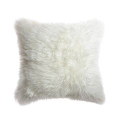 a white furry pillow on a white background