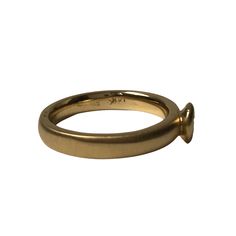 Spun Satin ring is a brushed finished 3.5mm band crafted in 14K yellow gold. Its simple, classic design will make a beautiful engagement ring. The band is a comfort fit, 3mm band that features a brushed finish. The bezel holds a .25ct H/SI1 diamond This ring can be worn all on its own or worn in a stack as pictured. Every Antique piece of jewelry we sell at Heirloom Pavé has been checked for safety of each prong and repaired as needed.***With any pre-owned/Vintage/Antique items, it is common to Classic Ring With Tension Setting And Thick Band, Yellow Gold Promise Ring With Smooth Bezel, Formal Recycled Gold Stackable Rings With Round Band, Formal Stackable Rings With Round Band In Recycled Gold, Formal Stackable Rings In Recycled Gold, Formal Stackable Round Band Rings In Recycled Gold, Yellow Gold Rings With Tension Setting Thick Band, Hand Forged Round Band Promise Ring, Hand Forged Round Band Rings For Promise