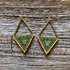 "These beaded triangle shaped earrings were handwoven one bead at a time with size 11/0 Miyuki glass seed beads. A time intensive and intricate craft, each bead is carefully hand stitched in order to create an evenly woven beaded fabric. The process requires focus, patience and dedication, as even a small pair of beadwork earrings can take hours to complete.  Handwoven Brick Stitch Beadwork Miyuki delica glass seed beads in Matte and shiny 24k gold plated 14k gold filled ear wires Brass triangle Brick Stitch Earrings, Turquoise And Gold, Beaded Earrings Patterns, Fabric Beads, Triangle Earrings, Beaded Hoop Earrings, Beaded Hoops, Earring Patterns, Seed Bead Earrings