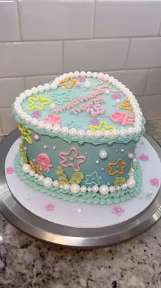 a decorated cake sitting on top of a counter