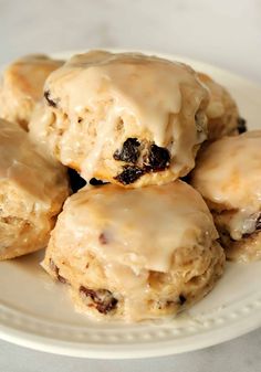 a white plate topped with cookies covered in icing