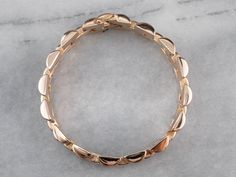 This bracelet is a true classic that is easy to incorporate into any wardrobe! Crafted from 14 karat rose gold, this unisex style has gate links that offer structure while still being fluid and comfortable on the wrist. Metal: 14K Rose Gold Width: 12 mm Length: 6.75 Inches Marks: "H 585" Stamped on the clasp Luxury Rose Gold Classic Chain Bracelet, Luxury Tarnish Resistant Rose Gold Bracelet, Luxury Vintage Rose Gold Bracelets, Luxury Elegant Gold Bracelet With Solid Link Construction, Luxury Rose Gold Box Chain Bracelets, Luxury Rectangular Tarnish Resistant Jewelry, Luxury Bracelets With Gold-tone Hardware, Luxury Rose Gold Stainless Steel Bracelets, Luxury Tarnish-resistant Rose Gold Bracelet