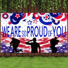 we are so proud of you sign with silhouettes of soldiers and an american flag