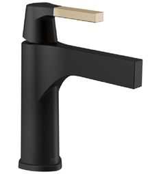 a black faucet with gold handles