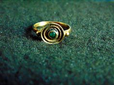 Beautiful women's gemstone ring. It is made completely out of 14k gold (aka gold 585 each piece is stamped), with a stunning emerald in its center... 14k Gold Byzantine Round Ring, 14k Gold Byzantine Style Round Rings, 14k Gold Byzantine Style Rings, 14k Gold Byzantine Ring Gift, 14k Gold Byzantine Style Gift Rings, 14k Gold Byzantine Ring As Gift, Byzantine Round Hallmarked Jewelry, Green Byzantine Style Round Jewelry, Byzantine Ring With Bezel Setting For Gift