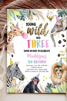 an animal themed birthday party with zebras, giraffe and monkey on it