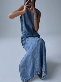 Maxi dress in washed blue denim material. High rounded neckline, sleeveless. Model is wearing MINUSEY S. ✔️ Free worldwide express shipping over $100✔️ Loved by 6,500+ customers✔️ Limited edition collections, maximum styleStay ahead of the trend with can’t-find-anywhere-else staples. Your closet will thank you 💕 * MINUSEY S = EU 34, US 2* MINUSEY M = EU 36, US 4* 100% Cotton Denim* Dry clean* Made in Korea - Model Height: 170cm/5'7" (US2, EU34) Sleeveless Washed Dark Wash Denim Top, Sleeveless Dark Wash Denim Top, Sleeveless Washed Denim Top, Washed Blue Sleeveless Denim Vest, Sleeveless Indigo Denim Dress, Sleeveless Medium Wash Denim Dress, Sleeveless Denim Washed Dresses, Washed Sleeveless Denim Vest, Indigo Sleeveless Denim Dress