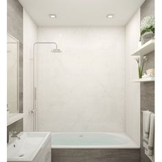 a bathroom with a bathtub, sink and shower head mounted to the side of the wall