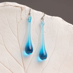 "These Light blue long teardrop dangle earrings are made of glass in lampwork technique. The stainless steel hooks are hypoallergenic. They will not tarnish, fade, or discolor with time. These unique and beautiful earrings are like water drops frozen in glass! They are simple and elegant, very lightweight and comfortable to wear, perfect for everyday wear and for special occasions. You will definitely receive lots of compliments on your new earrings, everybody loves them, and you'll love them to Long Teardrop Earrings, Blue Long Drop Teardrop Earrings With Ear Wire, Modern Blue Long Drop Earrings, Blue Long Drop Teardrop Earrings Gift, Blue Teardrop Drop Earrings, Blue Teardrop Earrings With Ear Wire, Modern Blue Teardrop Earrings, Blue Drop Earrings Hypoallergenic, Hypoallergenic Blue Teardrop Dangle Earrings