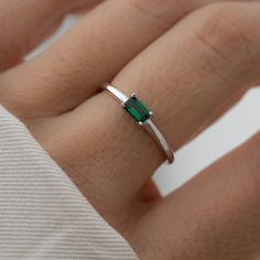 Beautifully crafted emerald ring is a true stunner! Looks great stacked or on its own! Made of 925 Sterling Silver 14K Gold or Rhodium plating Nickel-free & Hypoallergenic Baguette size: 3x5mm Available in sizes 4-10 Silver Rings With Emeralds, Emerald Baguette Ring, Layering Diamond Necklaces, Gold Ring Stacking, Smaragd Ring, Minimal Ring, Baguette Ring, Demi Fine Jewelry, Ring Dainty