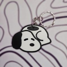 a keychain with a cartoon dog on it