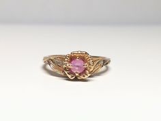 Vintage 14k Yellow Gold Rose Ring with Rose Quartz Center. Good pre-owned condition. Marked 14k. Beautiful, and elegant~!  * Ring size: 5 3/4 US * Weight: 3.1g * Band width: 1.3mm (Item #2274) Gold Rose Ring, Abalone Ring, Turtle Ring, Rose Ring, Sea Glass Necklace, Elegant Ring, 14k Gold Ring, Glass Necklace, Stackable Rings