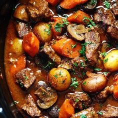 beef stew with potatoes and carrots in a slow cooker, ready to be eaten