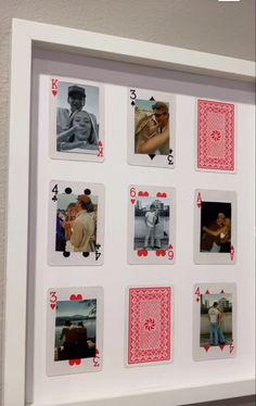 a white frame with playing cards on it