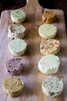 several different types of cheese on a cutting board