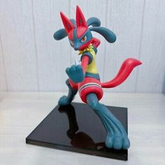 a toy figurine sitting on top of a table