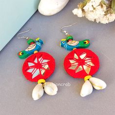 This Lightweight Handmade Red Peacock Mirror Earring for Women is made of Mirror, Seashells, and Thread. Women first love will always be jewelry; especially fashion jewelry completes the woman look. They can wear it on a different occasion and places like college or office party or beachside. You can match it with salwar suit, saree, ... Saree Kurta, Peacock Mirror, Parrot Earrings, Mirror Earrings, Red Peacock, Bold Statement Jewelry, Peacock Earrings, Chandbali Earrings, Thread Earrings