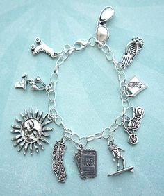 this charm bracelet features california inspired Tibetan silver charms(nickel free).the charms are attached to a silver tone 7.5 inches chain bracelet Silver Symbolic Bracelets With Dangling Charms, Symbolic Charm Bracelet With Dangling Charms, Symbolic Silver Bracelets With Dangling Charms, Symbolic Silver Bracelet With Dangling Charms, Nickel-free Sterling Silver Symbolic Charm Bracelet, Silver Symbolic Charm Bracelet Hypoallergenic, Symbolic Silver Hypoallergenic Charm Bracelet, Cheap Diamond Rings, Jewelry Display Cards