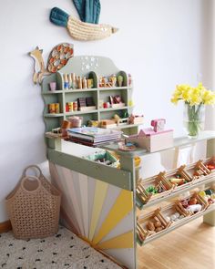 a child's play room with toys and accessories on the shelves, along with a toy storage unit