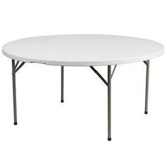 a white round table with four legs