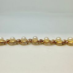 14K Gold Vintage 7.25" Bracelet with Pearls (includes appraisal, Value: $6,000) Designer = Jewelry Material = 14K Gold Gemstone = Pearl Condition = Good Class = Premier Location: Glencoe Item Number: 20229-16 Item ID: 281648 Category: Bracelet Elegant Formal Hallmarked Bracelets, Classic White Evening Bracelets, Luxury Pearl Bracelet With 17 Jewels, White Pearl Bracelet For Formal Occasions, White Pearl Bracelet For Formal Events, Formal Rose Gold Bracelet With Oyster Clasp, Formal Rose Gold Bracelet With Oyster Design, Luxury Pearl Bracelet For Evening, Formal Rose Gold Oyster Bracelet