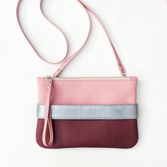 "Beautiful womanly burgundy clutch purse \"CarryMe\". Made of soft vegan leather, fabric inside. Unique GoodMoodMoon model. Dusty pink shoulder strap comes with clutch so you can wear it like cross body purse. Size: 9.5\" х 6.5\" (24 x 17 cm.) Shoulder strap length 46\" (118 cm.) Color: dusty pink + dark cherry (burgundy). Front handle color to choose: metallic gray, dusty pink, red. Front handle is easily changed on snaps - you can purchase additional handles of colors you like and change them Burgundy Clutch, Burgundy Purse, Vegan Purses, Clutch Purse Evening, Sling Bags, Wristlet Purse, Purse Crossbody, Evening Handbag, Pink Purse