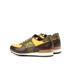 a brown and yellow sneaker with an animal print on the upper part of the shoe