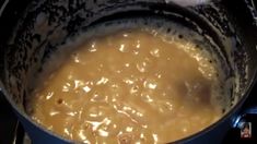 a pot filled with food sitting on top of a stove