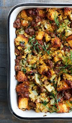 a casserole dish filled with stuffing and vegetables