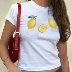 🍋 Lemon Baby Tee 🍋 Lemon Fruit Baby Tee | Coquette Y2K Baby Tee | Vintage Lemon Y2K Graphic Tshirt | 90s Aesthetic Clothing | Cute Summer Downtown Girl Top | Fruit Tshirt | Y2K Clothing | Fruit Graphic Tee | Vintage Style Top | Women's Tee |  2000s Trendy Top | Retro Graphic Shirt | Y2K Fitted Baby Tee ✨ FABRIC CONTENT Made with 100% US cotton ✨ SIZING The fit with a classic crew neck is supposed to be a bit longer than a crop top. If you want a true tight baby tee fit, you might want to size Baby Tees 90s, Fruit Graphic, Fruit Baby, Lemon Shirt, 2000s Baby, Fruit Shirt, Graphic Y2k, Retro Graphic Tees, Boho Shirt