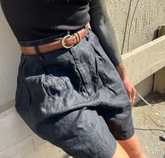 "Vintage high waist black 100 linen shorts Flattering and breezy; great quality you won't find in modern pieces with tightly woven midweight linen. Lined. Marked size small, fits estimated modern 25-27 depending on desired fit Excellent vintage condition, normal light wear with no significant flaws noted.  Measurements 13.25\" across waist lying flat 14\" rise 23.25\" across hips lying flat 6\" inseam 12.5\" across leg opening lying flat All items are sold as is with no returns and no partial re Chic Black Linen Shorts, Vintage Black Shorts For Summer, High Waist Vintage Shorts For Workwear, Vintage High Waist Shorts For Workwear, Vintage High-waist Shorts For Work, Black Bermuda Shorts With Belt Loops For Summer, Vintage Black Bottoms For Summer, Black Vintage Summer Bottoms, Vintage Black Summer Bottoms