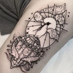 a woman's thigh with a clock and stars on it