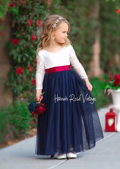 navy flower girl dress with sash, long sleeves Wedding Themes For Spring, Navy Flower Girl Dress, Flower Girl Dress With Sleeves, Flower Girl Hair Bows, Bohemian Flower Girl Dress, Navy Flower Girl, Flower Girl Dresses Navy, Vintage Flower Girls, Flower Girl Dresses Vintage