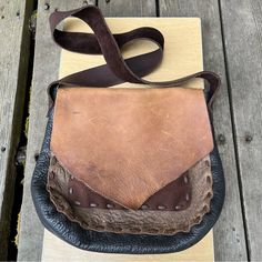 The Leather Vine Handmade Leather Unisex Messenger Crossbody Bag. In Browns & Blacks. Handmade By Artisan Dave Summers Out Of Nederland, Colorado Who Used To Live Here In Southern Oregon Where I Reside. Quality, Beautiful Rugged Piece. Rough Cut Flap Over Main Compartment With An Extra Inner Pocket & One Exterior Under The Flap. Width On Side Is What I Show In Picture Toward Top & Then Gets Thicker To The Same As Bottom Measurement Picture. There Is One Part On Flap That Has A Cut On Surface Of Leather & Scratches In Places Throughout, But It Only Seems To Enhance The Look Giving It A More Vintage Feel. Amazing Piece Rugged Distressed Brown Bag With Waxed Finish, Distressed Brown Waxed Finish Shoulder Bag For Daily Use, Distressed Brown Leather Bag With Waxed Finish, Distressed Brown Leather Shoulder Bag With Waxed Finish, Distressed Brown Leather-lined Satchel Shoulder Bag, How To Get Thick, Leather Craft Patterns, Rough Cut, Leather Craft