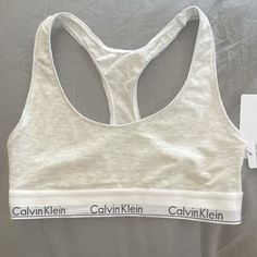 A Calvin Klein Icon. This Modern Bralette Is The Definition Of Effortless. Made With A Super-Soft And Supple Cotton-Blend Construction, This Bralette Provides Maximum Stretch For All Day Comfort. Designed With The Original Calvin Klein Logo Band, This Is A Sporty Look That Feels Sexy Everyday. Calvin Klein Bralette, Calvin Klein Ck One, Calvin Klein Bra, Lace Halter Bralette, Padded Bralette, Blue Bra, Calvin Klein Red, Black Bralette, Calvin Klein Women