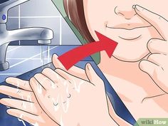 a woman is washing her hands in the bathroom sink with soap on her hand and an arrow pointing at it