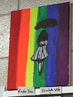 a painting of a woman holding an umbrella in front of a rainbow colored wall hanging