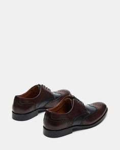 Experience the timeless style and sophistication with our EDREES dress shoes. Made with a genuine leather upper and featuring a classic wingtip design, these lace-up dress shoes blend perfectly with any formal outfit. Elevate your wardrobe with these expertly crafted, stylish, and comfortable dress shoes. 1 inch heel height Leather upper material Textile and synthetic lining Textile and synthetic sock Rubber sole Imported Formal Lace-up Shoes With Goodyear Welted Cap Toe, Formal Lace-up Shoes With Goodyear Welt And Cap Toe, Elegant Goodyear Welted Lace-up Derby Shoes, Formal Wingtip Oxfords With Rubber Sole, Elegant Goodyear Welted Lace-up Derby, Formal Wingtip Oxfords With Leather Sole, Classic Wingtip Derby For Semi-formal Occasions, Elegant Brown Wingtip Oxfords, Elegant Brown Derby Shoes With Brogue Detailing