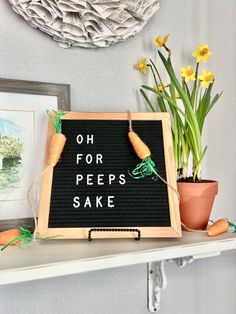 a sign that says oh for peeps sake with carrots and daffodils