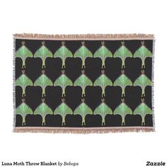 a black and green wall hanging with an intricate design