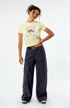 Step into street-style confidence with the Navy Low Rise Baggy Cargo Pants from PacSun. These pants feature a low-rise waist, contrast stitching throughout for added flair, belt loop details around the thigh, and cargo and patch pockets for utility. With their relaxed baggy fit, they offer both comfort and a bold, streetwear-inspired look for any casual outing.   	Model is wearing a size 26 	Model measurements: 5’7” height, 32” bust, 24” waist, 35” hip