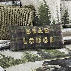 there is a bear lodge pillow on the bed