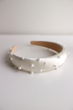 Bride padded pearl headband. This bridal white pearl headband is perfect for feminine, romantic, dreamy wedding. It's also a perfect choice for modern everlasting bridal look I hand stitch each of the pearls, so it's more durable and won't come out easily DETAILS of this bride white pearl headband: Width of this this headband: 2,5cm / 1 inches Adjustable for any of adult's head size, just like normal headband This bride white pearl headband is easy to wear - This bride white pearl padded headband is designed and handmade in Indonesia - This bride white pearl headband is available in white - Handcrafted  - White padded satin headband - This bride white pearl satin padded headband comes in a box  All of our bridal hair accessories are made to order, please see individual item for processing White Pearl Headband, Pearl Wedding Headband, Headband Bride, Pearl Headband Wedding, Headband White, Pearl Headpiece, Satin Headband, Feminine Romantic, Padded Headband