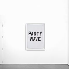 a white wall with a black and white sign on it that says party wave hanging from the wall