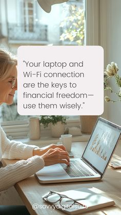 a woman sitting in front of a laptop computer on top of a wooden desk next to a window