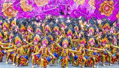 a large group of people dressed in colorful costumes